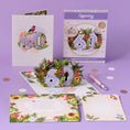 Load image into Gallery viewer, 60th birthday card for her by Cardology - floral theme for mothers, mums, sisters, aunts, friends and more - lifestyle image of the card open with the envelope and notecard
