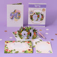 Load image into Gallery viewer, 90th birthday pop up card for her - floral theme with butterflies, birds and flowers - lifestyle image of card open with envelope and notecard