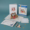 Load image into Gallery viewer, Battersea Cats Love Pop Up Card by Cardology which is perfect for Valentine's Day Cards, Mother's Day Cards, Father's Day Cards or even for Birthday Cards or Anniversary Cards. Pet mum and dad cards. This is a lifestyle image of the 3D Cats Card open with the notecard, card cover, reversible envelope and packaging all displayed.