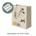 Load image into Gallery viewer, Battersea Dogs & Cats Home Christmas Medium sized gift bag - close up image of gift bag which includes 2 x battersea gift tags