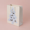 Load image into Gallery viewer, Battersea Dogs & Cats Home Charity Christmas Gift Bag For Dog Lovers - lifestyle image of christmas gift bag for dog owners