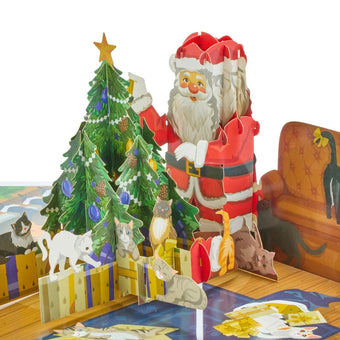 3D charity Santa Cat pop-up Christmas card fully opened featuring santa next to a christmas tree surrounded by lots of cats.