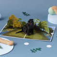 Load image into Gallery viewer, Cardology Black Labrador Pop Up Card - lifestyle image of card open