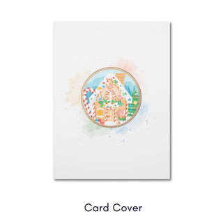 Front of Christmas card featuring festive gingerbread house illustration on cream cardstock