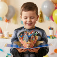 Load image into Gallery viewer, Child holding a superhero-themed Justice League pop-up card
