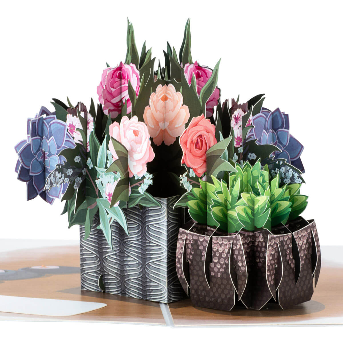 Peonies Pop Up Card by Cardology - Image shows close up of the card which shows a pop up table arrangement of beautiful peonies and a succulent in 3D form. 