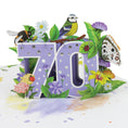 Load image into Gallery viewer, close up image of 70th birthday pop up card, soft lilac with foiled silver dots on the 3D pop up 70, surrounded by butterflies, birds and insects. Inspiration of the great british countryside
