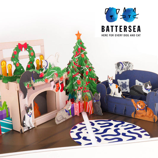 Battersea Charity Christmas Pop Up Card For Cat Lovers. Pop Up Christmas Tree, Sofa and Fireplace, surrounded by cats