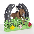 Load image into Gallery viewer, close up image of Cross Country Pop Up Card which features a 3D Olympic Legacy jump with a horse and rider jumping through