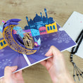 Load image into Gallery viewer, Eid Mubarak Pop Up Card being held fully open