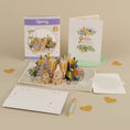 Load image into Gallery viewer, Golden Wedding Anniversary Card for a 50th Wedding Anniversary Gift - lifestyle image of 50th wedding anniversary card close up with notecard and gifting envelope