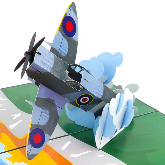 Close up image of Spitfire Pop Up Card featuring a 3D mark 9 spitfire bursting through the clouds over the white cliffs of dover
