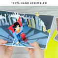 Load image into Gallery viewer, DC Comics Superman Birthday Pop Up Card - Hands Holding Card Open