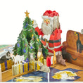 Load image into Gallery viewer, 3D charity Santa Cat pop-up Christmas card fully opened featuring santa next to a christmas tree surrounded by lots of cats.
