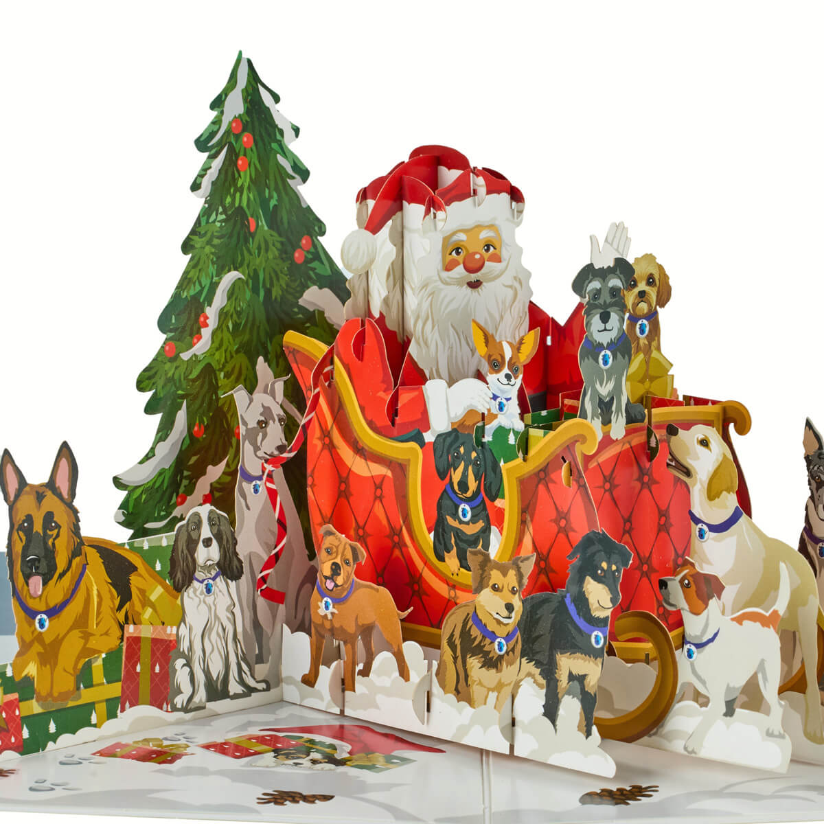 3D Santa Dogs pop-up charity card fully opened, featuring Santa in a sleigh surrounded by playful dogs in a snowy outdoor scene