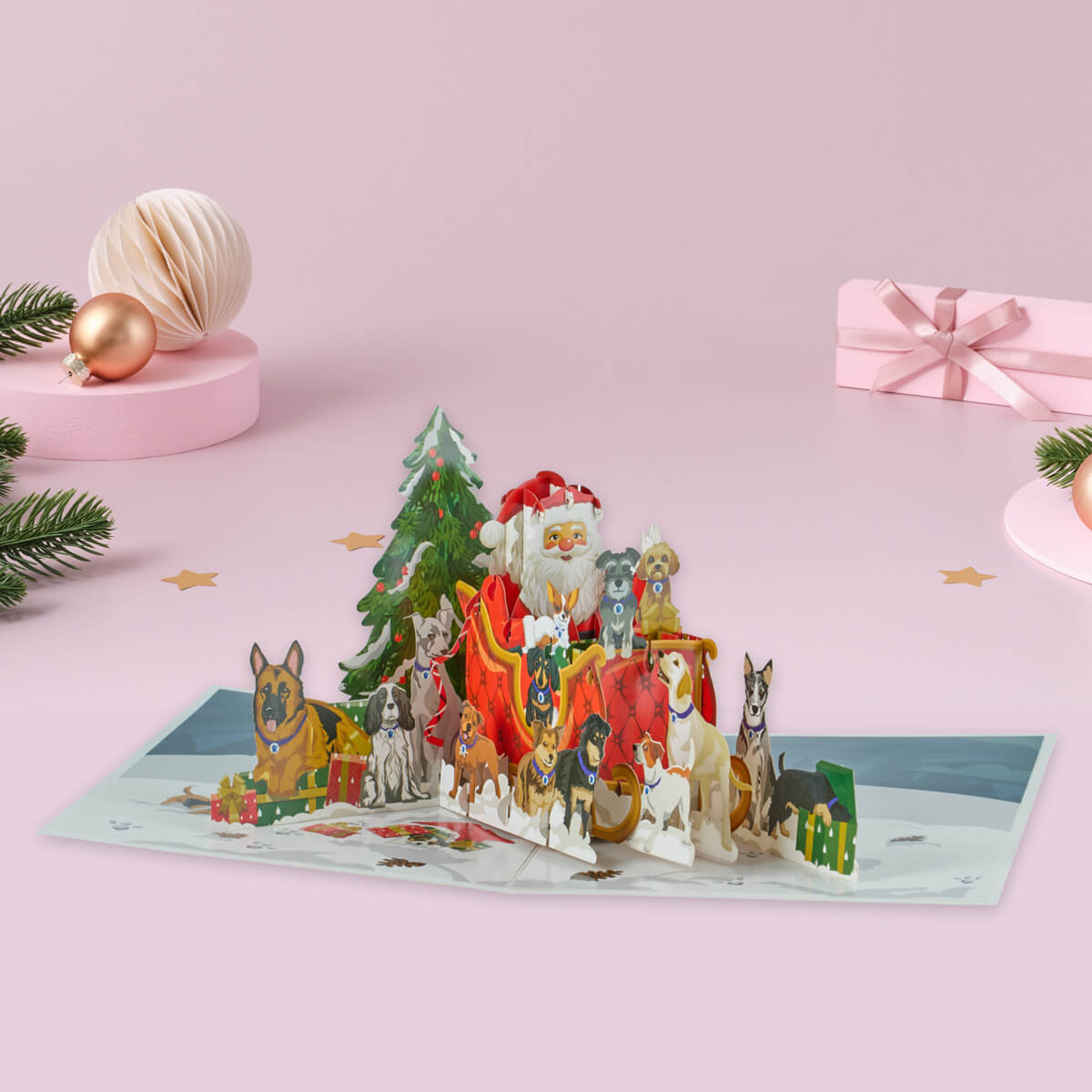 Pop-up Christmas card with Santa Claus and dogs on a pink background