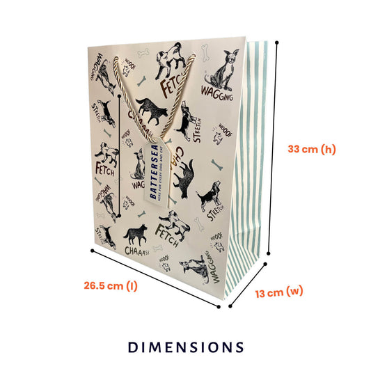 A Battersea gif bag  with dog-themed illustrations and text, shown with dimension lines and labels indicating 26.5 cm length, 13 cm width, and 33 cm height on a white background.