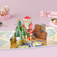 Load image into Gallery viewer, Charity Christmas 3D Pop Up Card - Santa Decorating a Christmas Tree Surrounded by Cats - Perfect For Cat Lovers - Battersea Dogs & Cats Home - by Cardology
