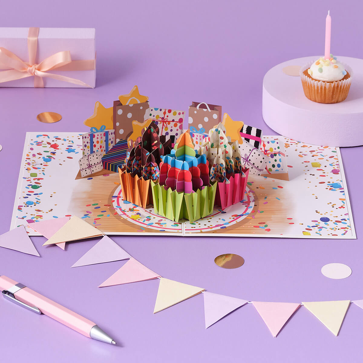 Birthday Cupcakes Pop Up Card by Cardology for Her, Him and Kids - lifestyle image with cake, bunting and confetti