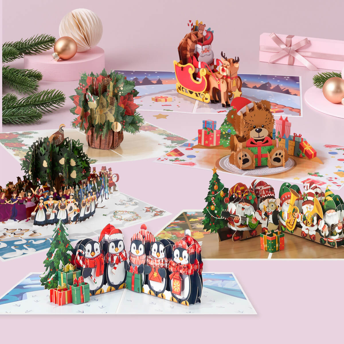 Collage of Christmas-themed pop up cards including penguins, teddy bears, and santa with reindeers.  