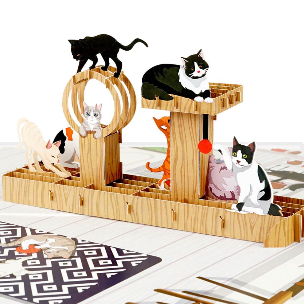 Close up image of Cat Tree Pop Up Card for cat lovers featuring 5 cats playing on a pop up cat tree