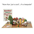 Load image into Gallery viewer, Christmas-themed pop-up card with animated gnomes and text 'Rockin' Around the Christmas Tree'.
