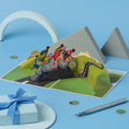 Load image into Gallery viewer, cycling pop up card by cardology - lifestyle image of 3D cycling birthday card for him
