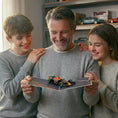 Load image into Gallery viewer, Man with two children holding his Fathers Day F1 Racing Car Pop Up Card open
