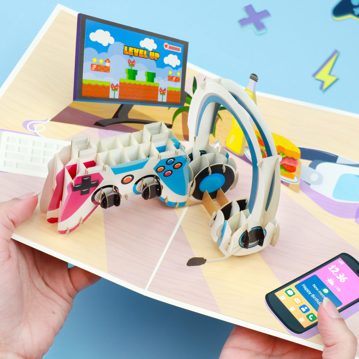 gaming pop up birthday card for gamers - lifestyle image of someone holding the card open