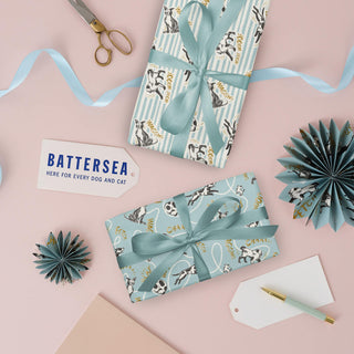 Battersea Dogs & Cats Home Gift Wrap for Dog Lovers - Pack of 4 sheets with 2 patterns. Perfect for birthdays and other celebratory occasions. Lifestyle image of both gift wrap patterns