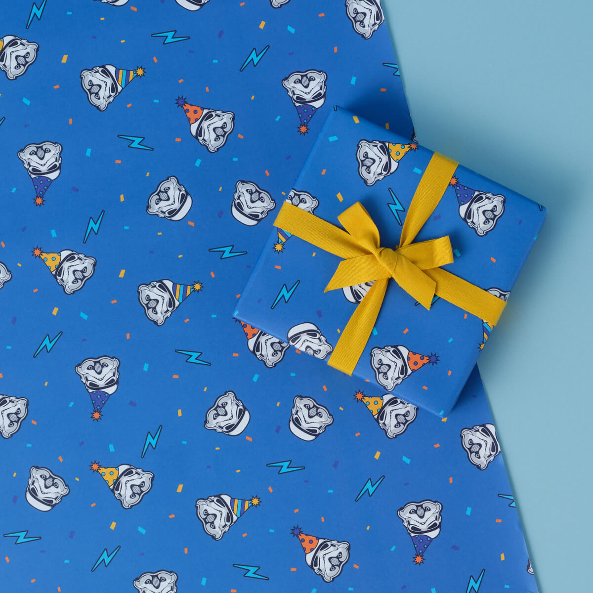 Original Stormtrooper Birthday Gift Wrap Set Pattern 2 which has Stormtroopers with party hats on and lightning bolts on a blue background