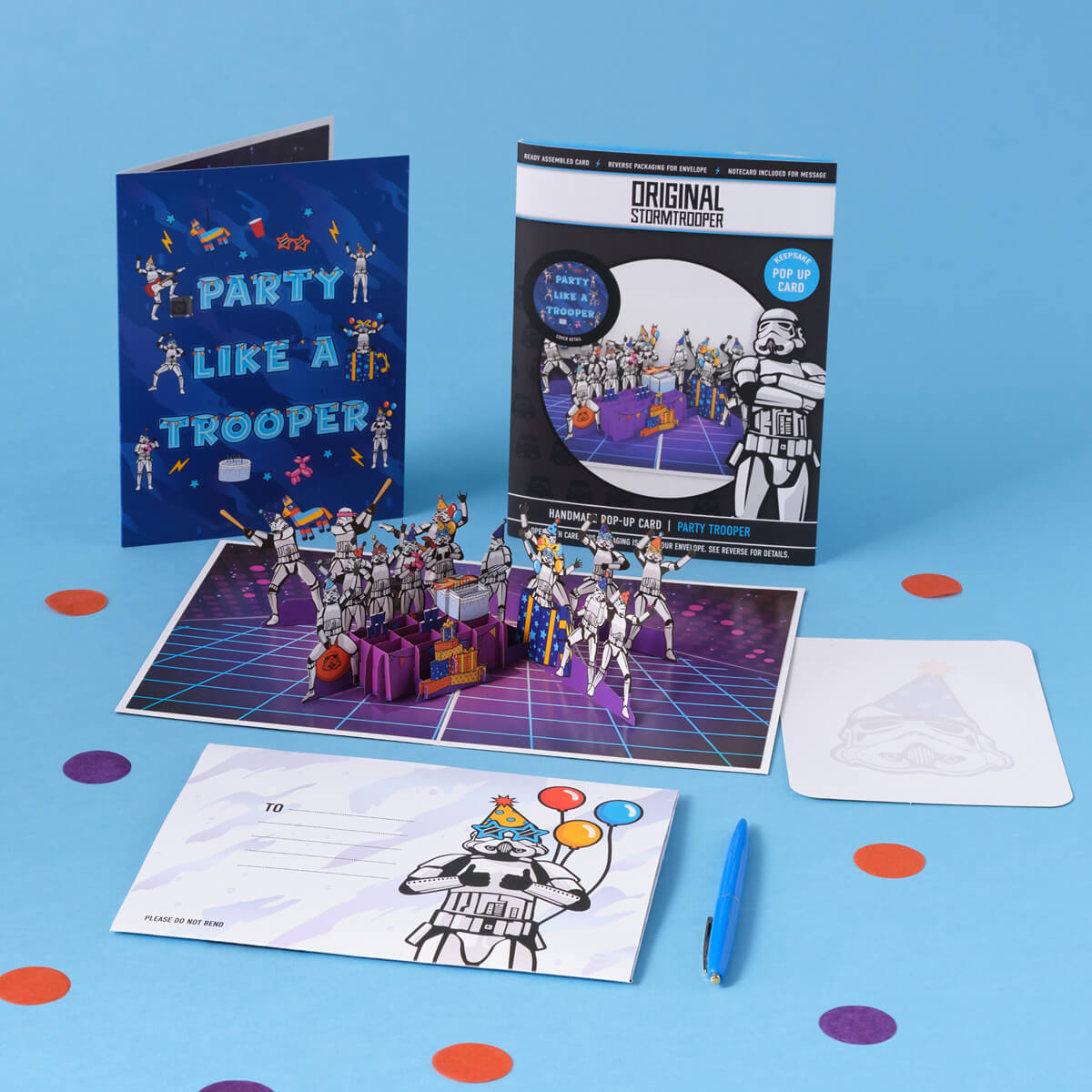 Original Stormtrooper Birthday Party Pop Up Card by Cardology - lifestyle image of all components which includes the card open with the notecard and envelope