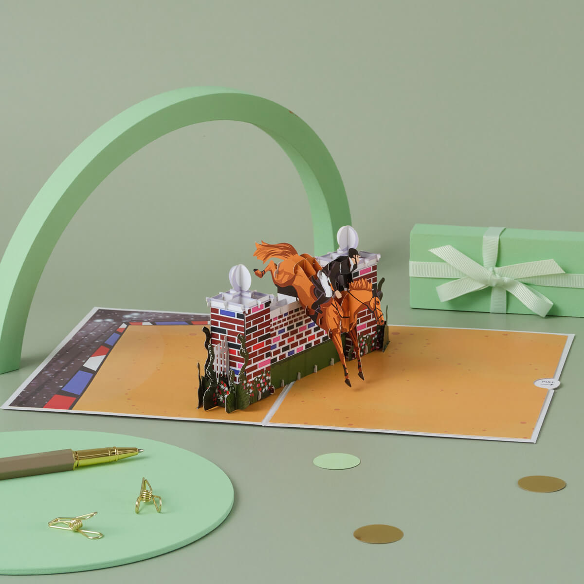 Show jumping pop up card by Cardology - lifestyle image of equestrian themed gift, which is a show jumping pop up card