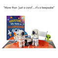 Load image into Gallery viewer, Space Explorer Pop Up Card perfect for Astronaut Gifts for Kids or Space Lovers - image of card open with a card cover behind
