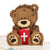 Close up image of Christening Bear Pop Up Card featuring a fluffy brown teddy bear holding a red bible with a cross on the cover