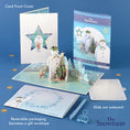 Load image into Gallery viewer, The Snowman Christmas Pop Up Card - Lifestyle Image Of Pop Up Card, Envelope, Notecard and Packaging
