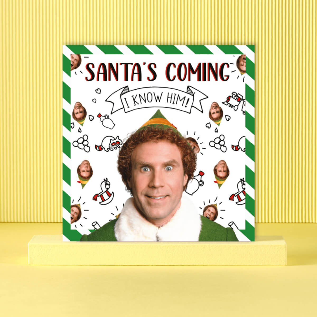 Buddy The Elf Funny Christmas Card Featuring Will Ferrell. Pictured on a yellow background lifestyle