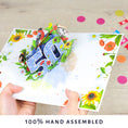 Load image into Gallery viewer, image of floral 50th birthday pop up card being held open
