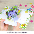 Load image into Gallery viewer, image of handmade floral 80th birthday pop up card being held open
