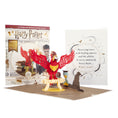 Load image into Gallery viewer, Image of Harry Potter Fawkes Pop Up Card Open with cover and packaging displayed behind
