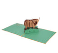 Load image into Gallery viewer, Highland Cow Pop Up Card featuring a 3D bronze highland cow standing among green grass, fully open at 180 degrees
