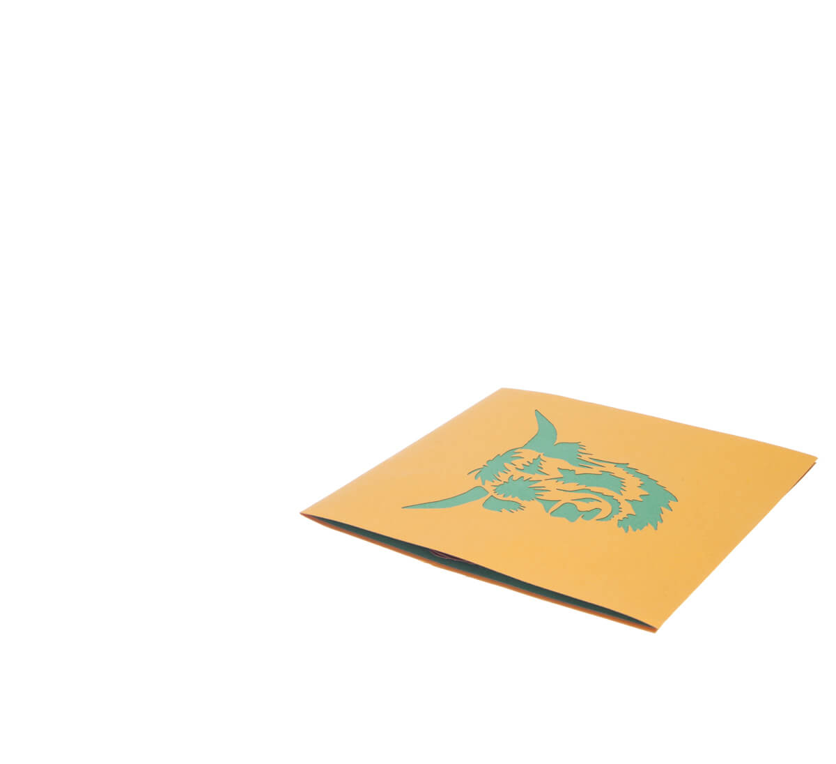 Highland Cow Pop Up Card featuring a 3D bronze highland cow standing among green grass, fully closed and flat on white surface