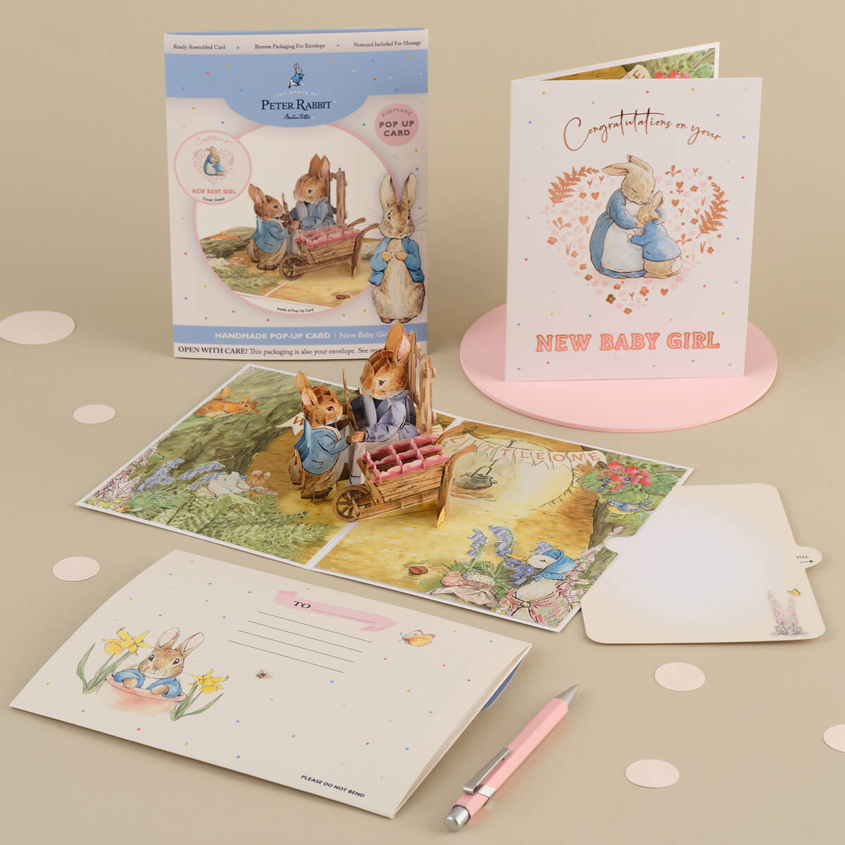 Peter Rabbit New Baby Girl Pop Up Card - Welcome Baby Girl Card - lifestyle image of pop up card, reversible envelope and slide out notecard