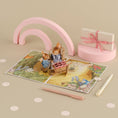 Load image into Gallery viewer, Peter Rabbit New Baby Girl Pop Up Card - Welcome Baby Girl Card - lifestyle image of 3D card
