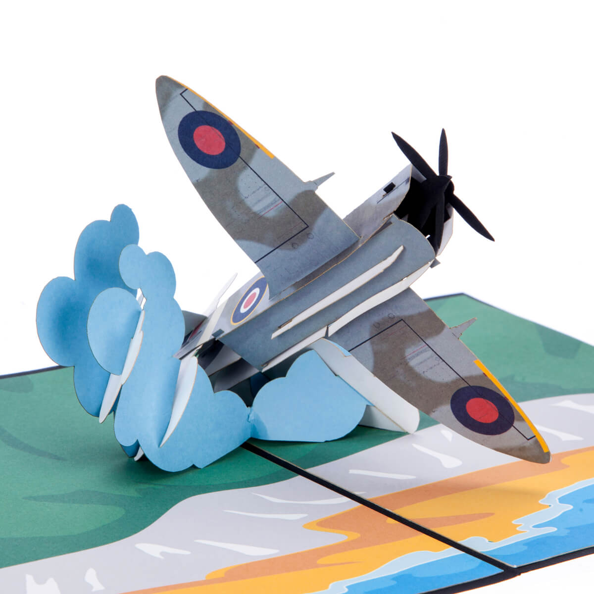 Close up image of Spitfire Pop Up Card featuring a 3D mark 9 spitfire bursting through the clouds over the white cliffs of dover