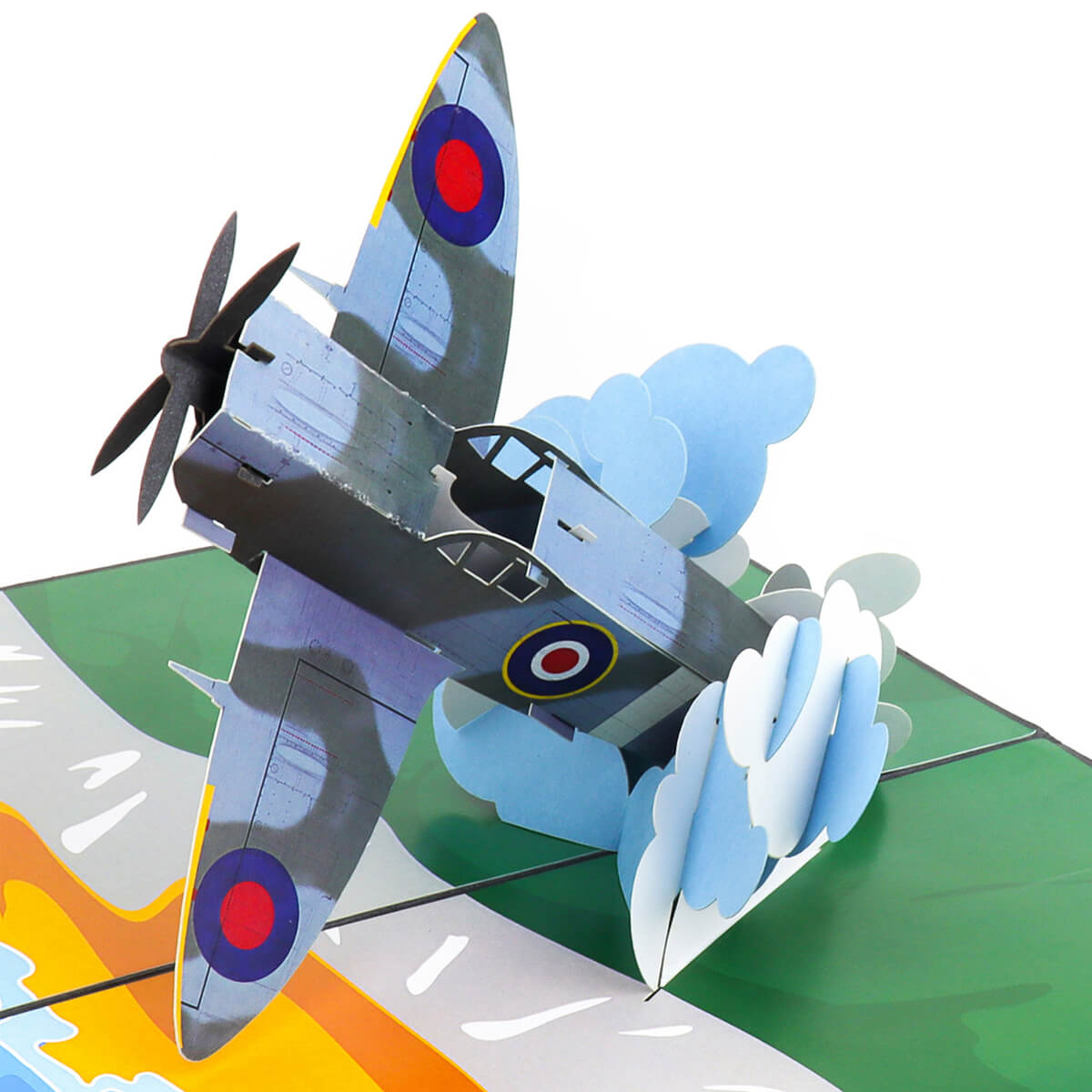 Close up image of Spitfire Pop Up Card featuring a 3D mark 9 spitfire bursting through the clouds over the white cliffs of dover