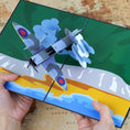 Load image into Gallery viewer, Spitfire Pop Up Card Image showing a pair of hands holding the card open
