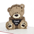 Load image into Gallery viewer, Close up image of Thank You Teacher Pop Up Card featuring a 3D brown fluffy bear holding a chalk board with Thank You written on it
