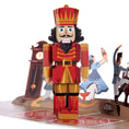 Load image into Gallery viewer, The Nutcracker Pop Up Card. Close Up Image of the 3D Nutcracker On A White Surface
